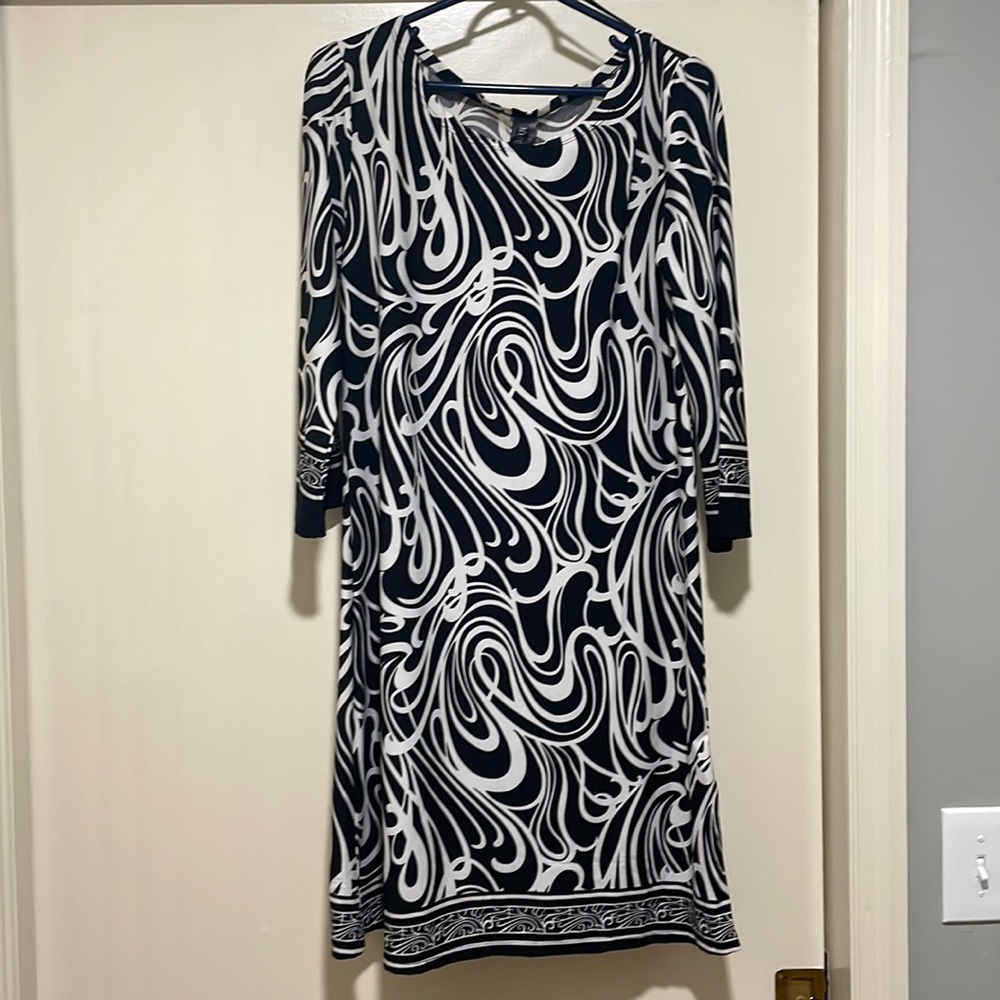 Black and white dress with tag.  Never worn.  Falls just below knee.